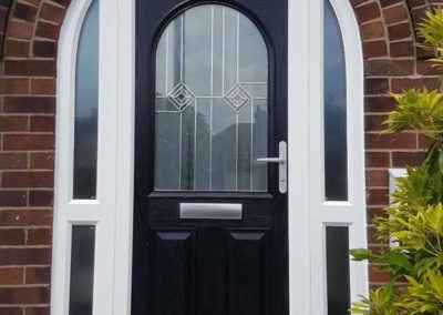 black door with arched doorway installation